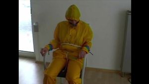 3sets of short videos with Katharina tied and gagged and hooded on a chair wearing shiny nylon rainwear (Video)