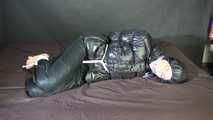 ***SEXY SONJA*** being tied and gagged on a bed with ropes and a clothgag wearing a sexy black shiny nylon down jacket and a black shiny nylon rain pants (Video)