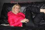 Watching sexy Pia wearing  a sexy black shiny nylon rain pants and a pink down jacket enjoying herself and lolling on the sofa (Pics)