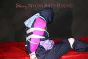 Watching Pia wearing blue/pink shiny nylon rainwear being tied and gagged and hooded with tape and a clothgag (Pics)