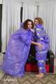 Terry and Vanessa - Terry in raincoat is taped and teased by Vanessa