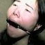 25 YEAR OLD ASIAN MAI-LING IS TIED ON BED, ACE BANDAGE GAGGED, RING-GAGGED, BALL-GAGGED, MOUTH STUFFED, HANDGAGGED, WRIST-GAGGED & F0RCED TO HANDGAG HERSELF (D59-3)
