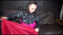 Watching Mara preparing her sofa with shiny nylon cloth wearing a sexy rainwear combination (Video)