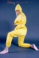 Blonde-haired archive girl wearing supersexy yellow rainwear while posing infront of the camera (Pics)