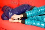 SEXY ALINA playing with cuffs wearing a hot blue shiny nylon down pants and a green down jacket lolling on the sofa (Pics)