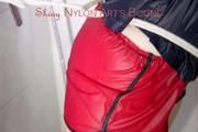 Jill tied and gagged on a shower with cuffs wearing a sexy red shiny nylon shorts and a black rain jacket (Pics)