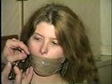 ONE SEXY TAPE BOUND, WRAP TAPE & BALL-GAGGED HOSTAGE (D24-17)