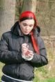 Jill tied, gagged and hooded on a tree outdoor wearing a shiny black down jacket (Pics)