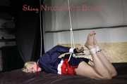 Sexy Pia being tied and gagged on a sofa with ropes and a cloth gag wearing a sexy darkblue shiny nylon shorts and a blue/red rain jacket (Pics)