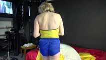 *** Sexy MIA wearing a blue shiny nylon shorts and a yellow top during changing the cloths on her bed  (Video)***