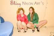 Leonie and Stella posing and having fun with eachother wearing supersexy shiny nylon shorts and rain jackets (Pics)