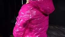 Watching sexy Sandra wearing a sexy pink shiny nlon rain pants and a shiny nylon pink down jacket nestle down in a down cover (Video)