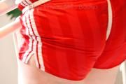 Jill tied and gagged standing on a stairway wearing a sexy red adidas shiny nylon shorts and a top (Pics)