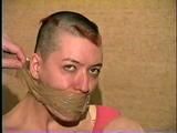 PUNK GIRL MELA IS WRAP TAPE GAGGED, BAREFOOT, TOE-TIED & BALL-TIED ON THE BED (D46-15)