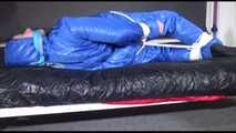 Lucy tied and gagged with ropes on bed wearing sexy blue oldschool downwear (Video)