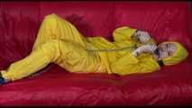 ***MARA*** ties and gagges with cuffs on the sofa wearing a supersexy oldschool yellow rain suit with hood (Video)