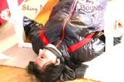 Mara tied and gagged on a bottom-up table wearing a supersexy black/red downwear combination (Pics)