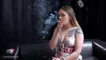 Tattooed girl is smoking a marlboro red