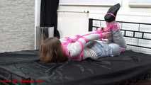 Tight hogtie with pink ropes