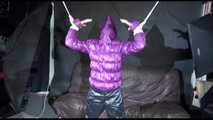 Sexy Sandra being tied and gagged overhead with ropes and a bar wearing a sexy black rain pants and a purple down jacket with hood closed (Video)