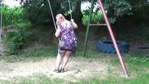 Miri cuffed on a swing