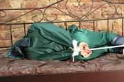 Pia tied, gagged and hooded in a princess bed wearing sexy shiny green rainwear (Pics)