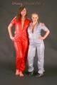 Alina and a friend of her posing infront of a camera both wearing sexy shiny nylon jumpsuits (Pics)