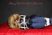 Sonja being tied, gagged and hooded on a shiny nylon bed with ropes and a clothgag wearing a supersexy shiny nylon rain pants and a black down jacket with fur (Pics)