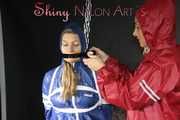 Watching sexy Sandra being tied and gagged overhead with ropes and a clothgag from Stella both wearing sexy shiny nylon AGU rainwear (Pics)