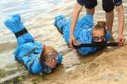 Dana and Asya - both ends up packed in trash bags in the water