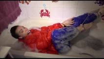 Jill ties and gagges herself in a bath tub for having an extraordinary experience wearing a sexy lightblue rainpants and an orange down jacket (Video)