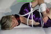 Sonja bound and gagged in a shiny wetlook Dress