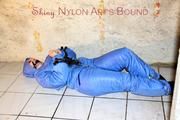 Jill tied, gagged anmd hooded with old handcuffs lying in an old cellar wearing a sexy lightblue skibib (Pics)