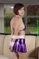 Danny bound in a shiny purple Skirt and Bra, gagged with a Silkscarf