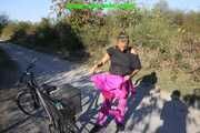Watch Sandra enjoying her shiny nylon Suit riding a Bike