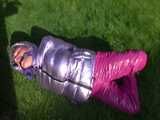 Watch Sandra being bound and gagged in her shiny nylon Downjacket