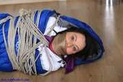 Irina helpless in down jacket and bedroll