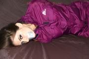 Shelly tied and gagged in a shiny nylon rainauit 