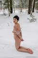 Naked barefoot Claudia tied up in cold winter snow