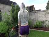 Get a video with Chloe enjoying gardening in her shiny nylon Shorts