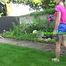 Watch Maly in her shiny nylon Shorts enjoying the warm Weather in the Garden