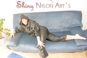 Jill naked putting on a supersexy black shiny nylon rainsuit and lolling on the sofa (Pics)
