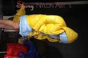 Watching sexy Stella and Sandra wearing a sexy shiny nylon shorts putting on several chiny nylon down jackets (Pics)