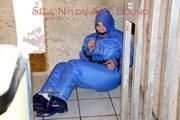 Jill tied, gagged anmd hooded with old handcuffs lying in an old cellar wearing a sexy lightblue skibib (Pics)