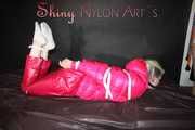 ***COURTNEY***NEW MODELL***being tied and gagged with ropes and a ballgag on a sofa wearing a pink rain pants and a pink doen jacket (Pics)