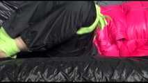 Pia wearing a supersexy black rain pants and a pink down jacket tied, gagged and hooded with cloth (Video)