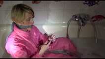 Get 2 long Archive Videos with Sonja bound and gagged in the bathroom in her shiny nylon Downwear