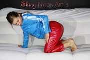 Watching sexy Sandra putting on a very special red shiny nylon pant posing and lolling for you (Pics)