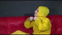 ***MARA*** ties and gagges with cuffs on the sofa wearing a supersexy oldschool yellow rain suit with hood (Video)