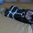 Blond-haired maid tied and gagged on bed wearing a shiny black PVC sauna suit (Video)